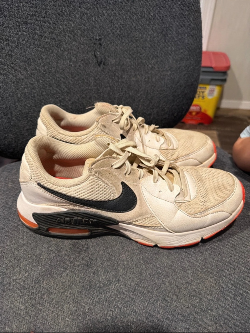 Nike Kids Beige Sneakers with Black Swoosh and Orange Accents